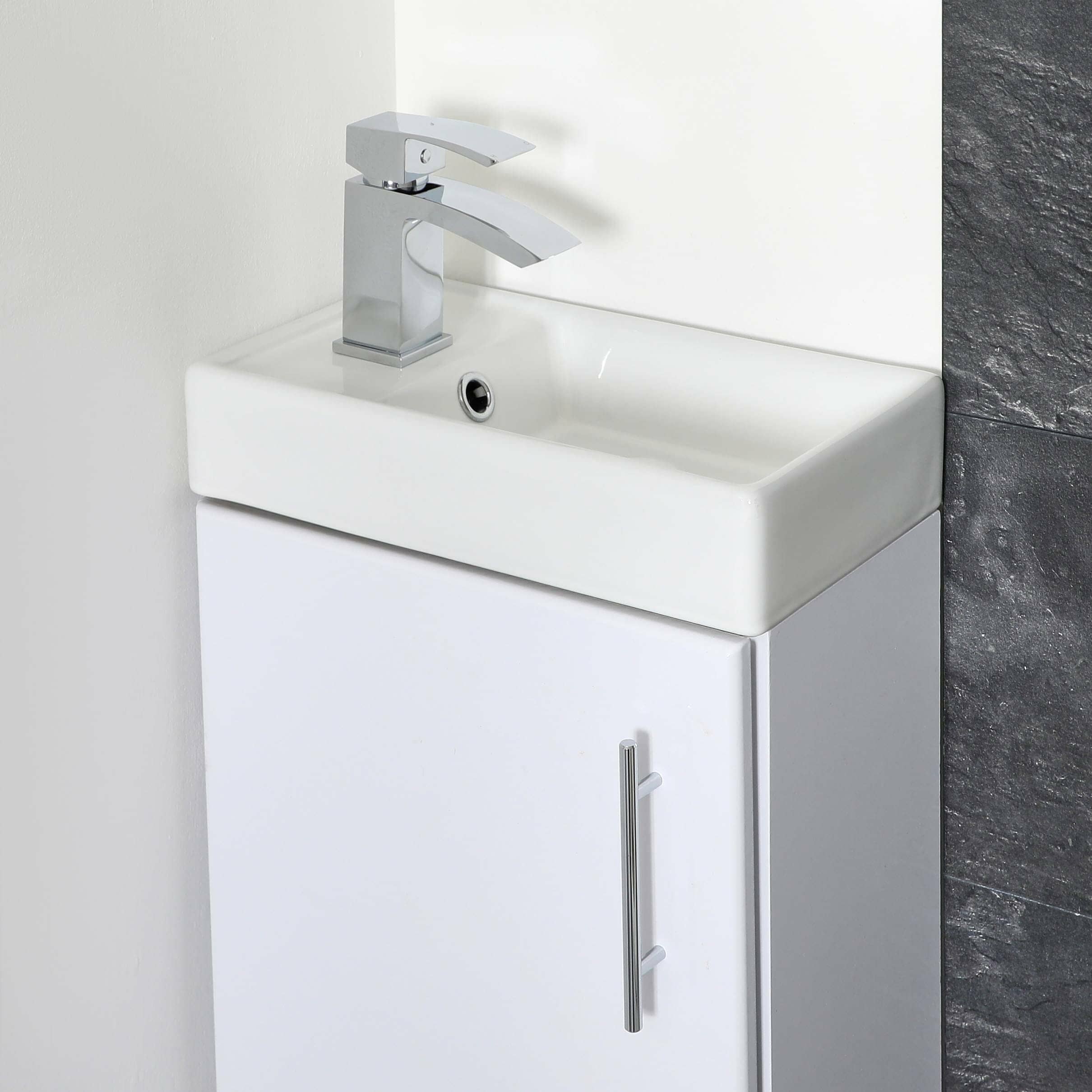 Fond Un Cabinet De Toilette Compact équipé Dun Lavabo Et Dun Lave